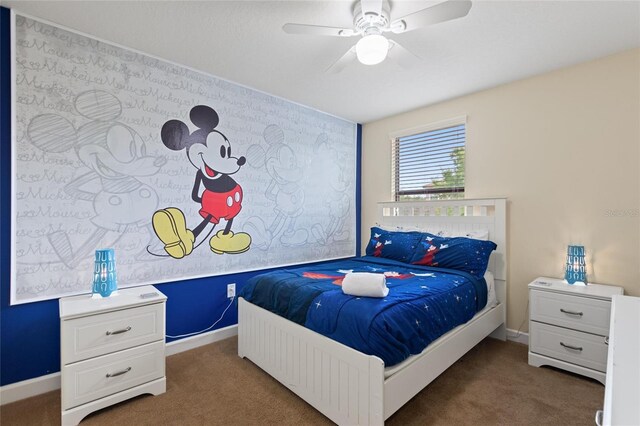 carpeted bedroom with baseboards and a ceiling fan
