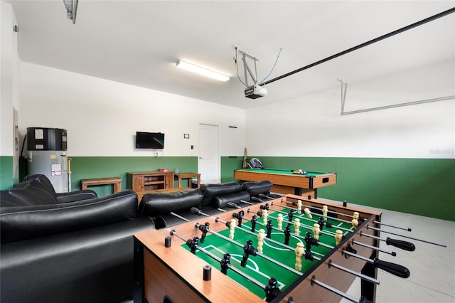 playroom with water heater, billiards, and a garage