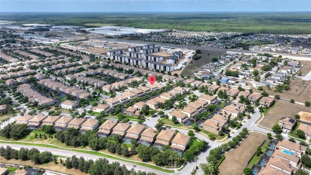 birds eye view of property with a residential view