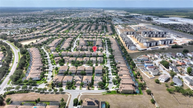 birds eye view of property with a residential view