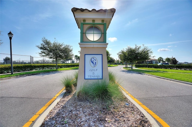 exterior space featuring curbs, sidewalks, and street lights