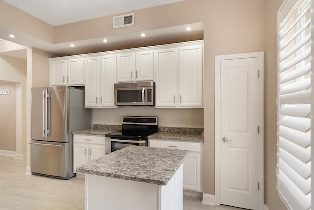 kitchen with white cabinets, appliances with stainless steel finishes, recessed lighting, baseboards, and visible vents