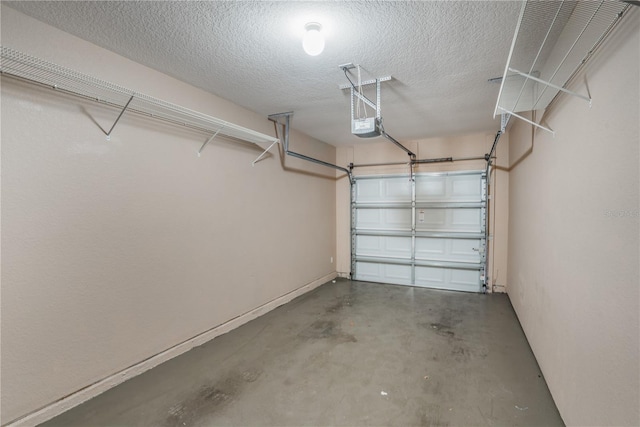 garage featuring baseboards and a garage door opener