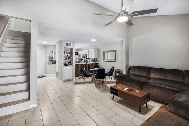 5077 Ernst Ct Unit 3, Orlando, FL 32819 - living room with recessed lighting, light tile patterned flooring, ceiling fan, stairs, and visible vents