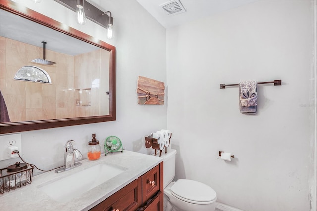 5077 Ernst Ct Unit 3, Orlando, FL 32819 - full bathroom featuring toilet, visible vents, tiled shower, and vanity
