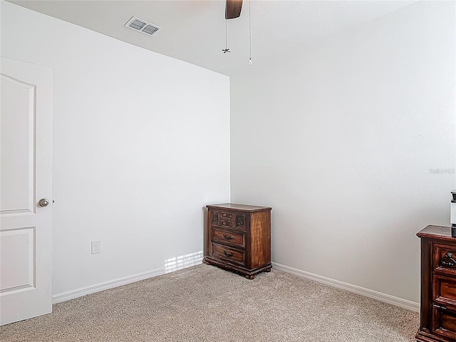carpeted bedroom featuring baseboards, visible vents, and ceiling fan