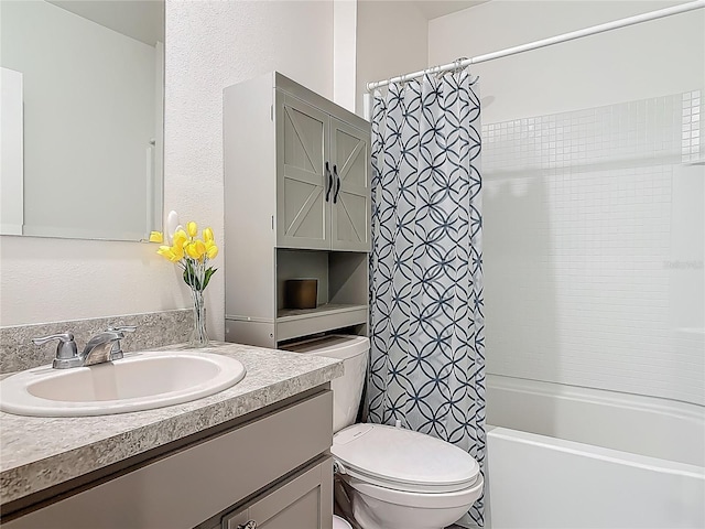 bathroom with shower / bath combination with curtain, toilet, and vanity