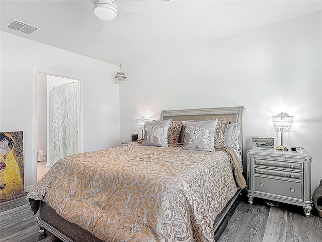 bedroom featuring visible vents, wood finished floors, and a ceiling fan