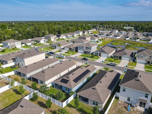 birds eye view of property featuring a forest view and a residential view