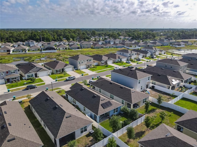 birds eye view of property with a residential view