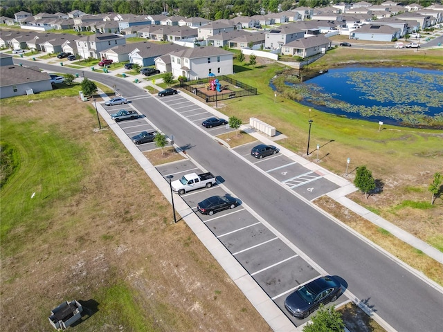 aerial view featuring a residential view and a water view