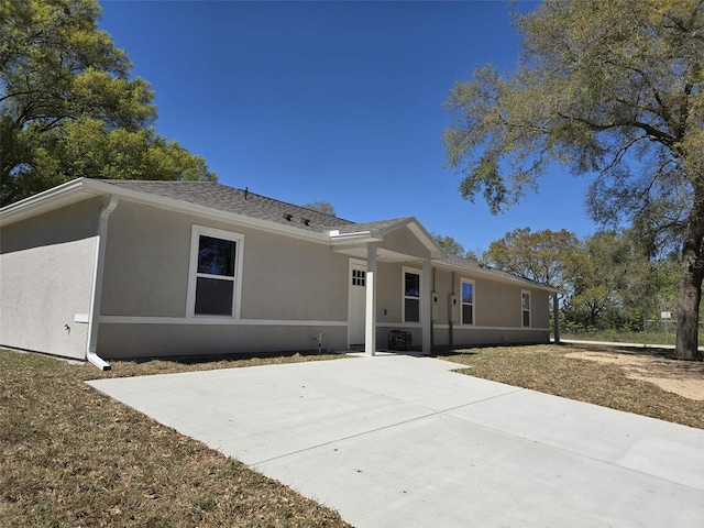 346 NW 24th Ave, Ocala, FL 34475 - rear view of property featuring stucco siding and a patio area