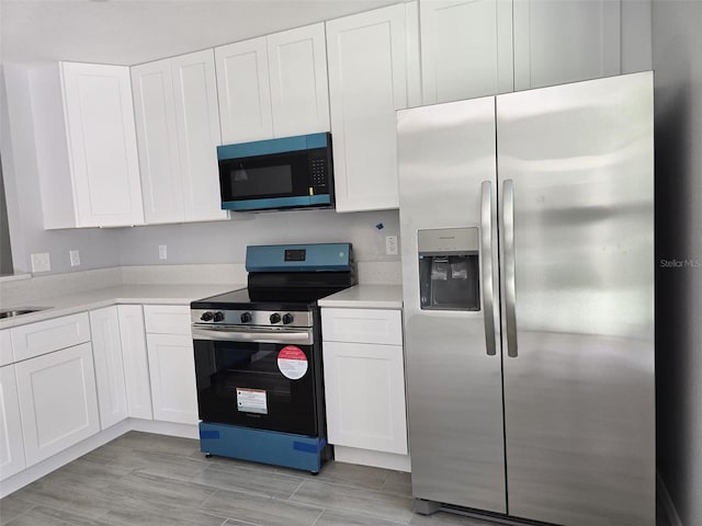 346 NW 24th Ave, Ocala, FL 34475 - kitchen with white cabinetry, stainless steel appliances, and light countertops