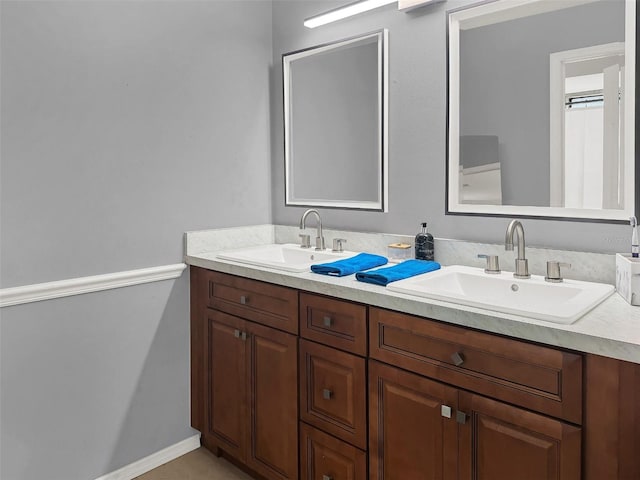 bathroom with double vanity and a sink