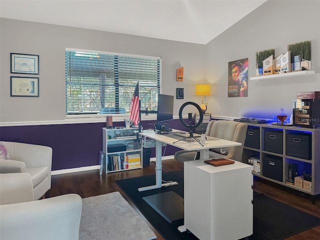 home office featuring baseboards, wood finished floors, and lofted ceiling