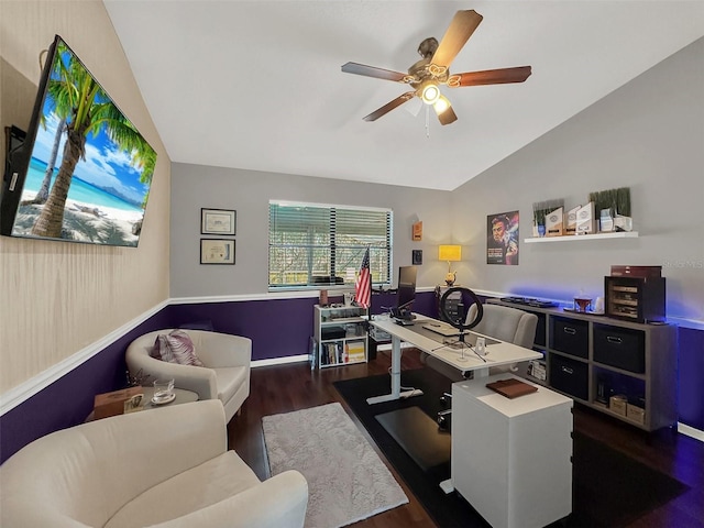 home office featuring a ceiling fan, baseboards, wood finished floors, and lofted ceiling