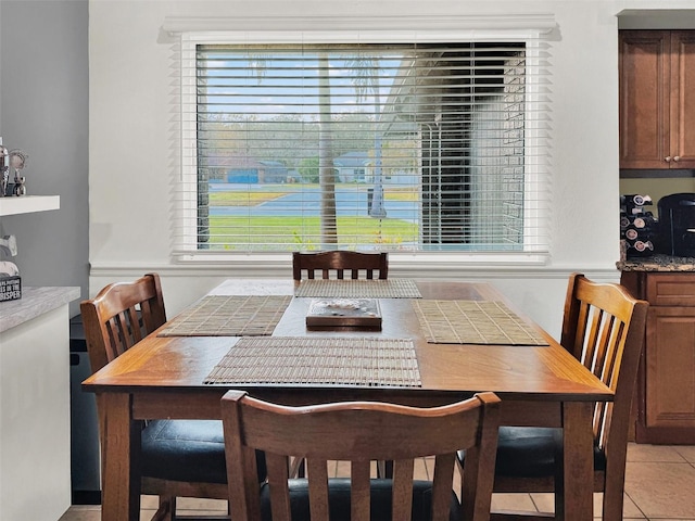dining area with light tile patterned floors