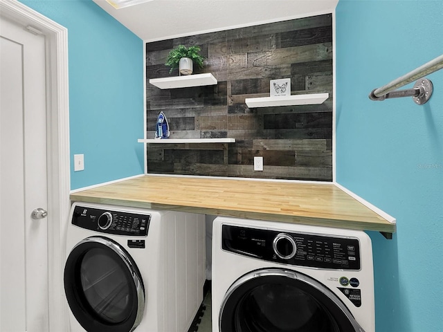 laundry area featuring separate washer and dryer and laundry area