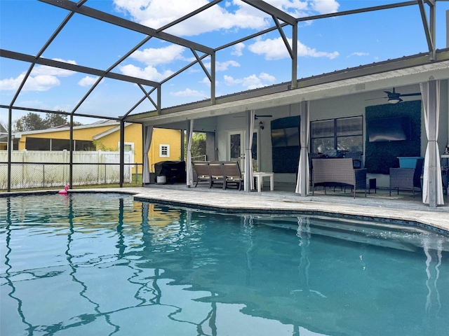 view of pool featuring a lanai, a ceiling fan, a patio area, a fenced in pool, and outdoor lounge area
