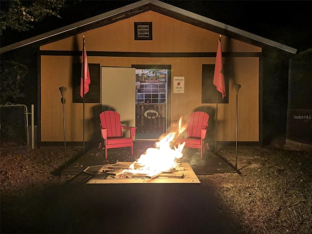exterior space featuring an outdoor fire pit