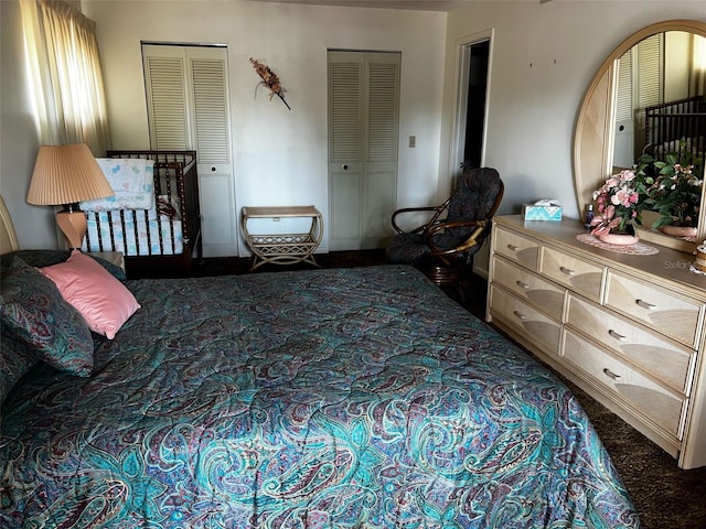 2659 Crown Ct Unit 11, Kissimmee, FL 34741 - bedroom featuring two closets and carpet flooring