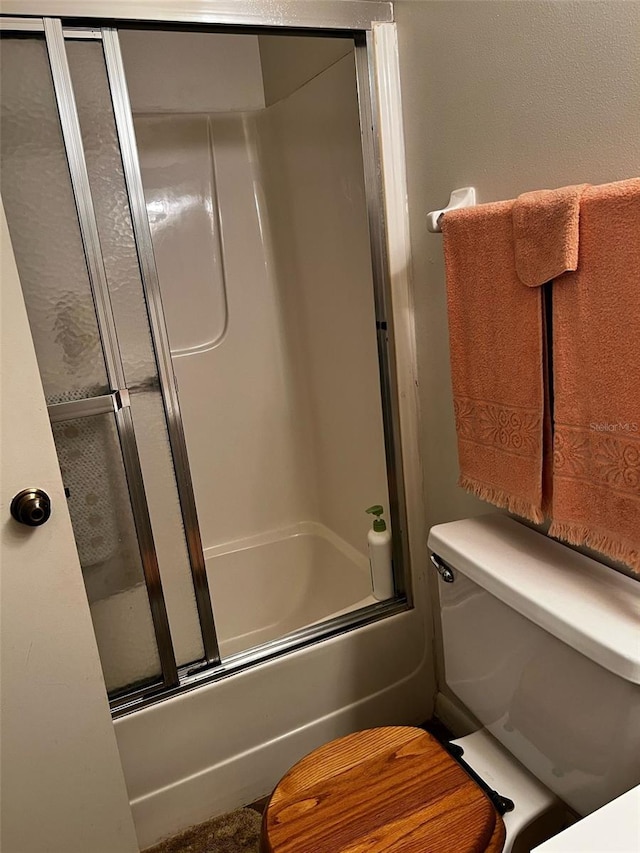 2659 Crown Ct Unit 11, Kissimmee, FL 34741 - full bathroom with toilet and bath / shower combo with glass door