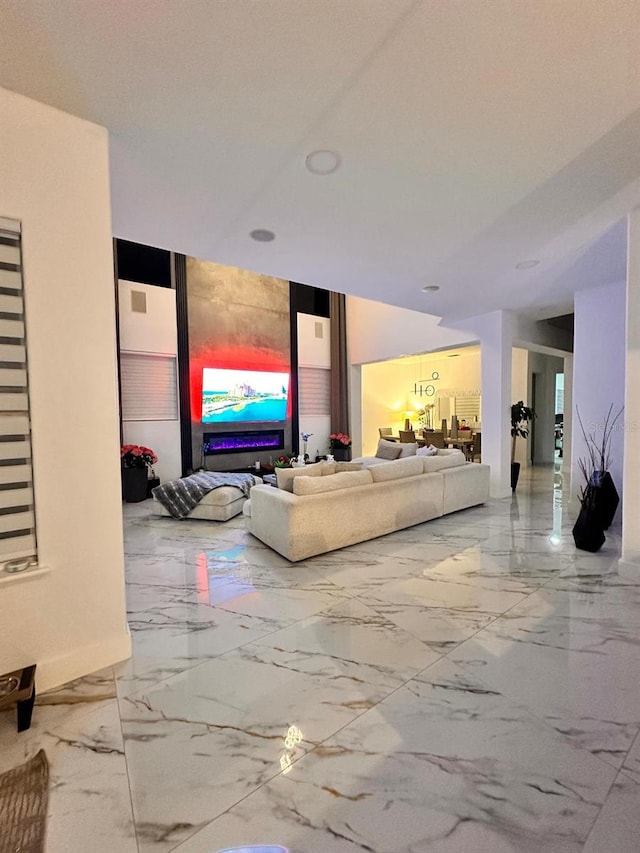 living area with marble finish floor