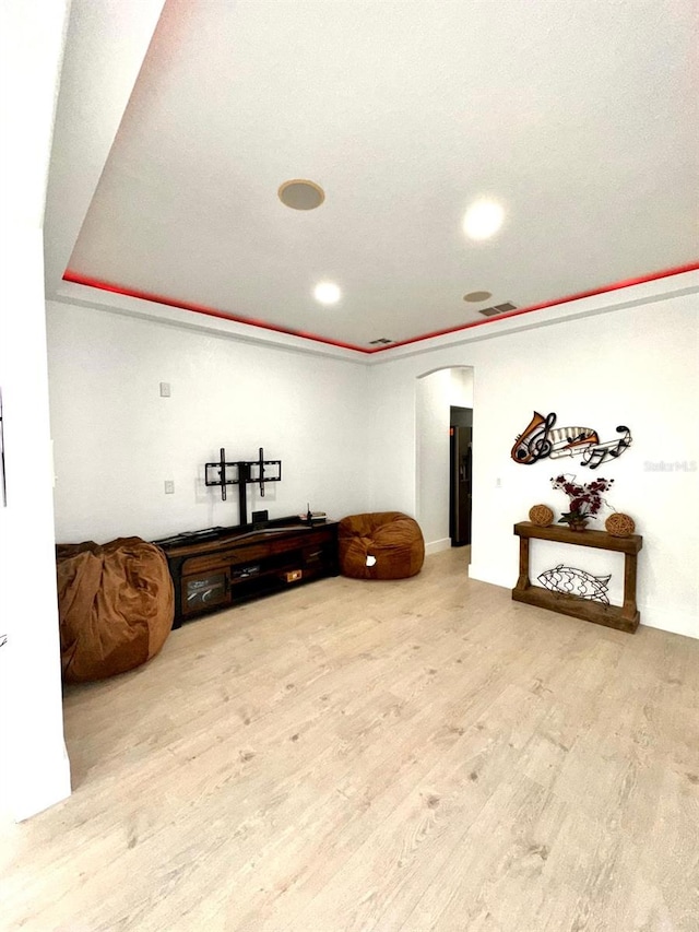 interior space with recessed lighting, arched walkways, visible vents, and wood finished floors