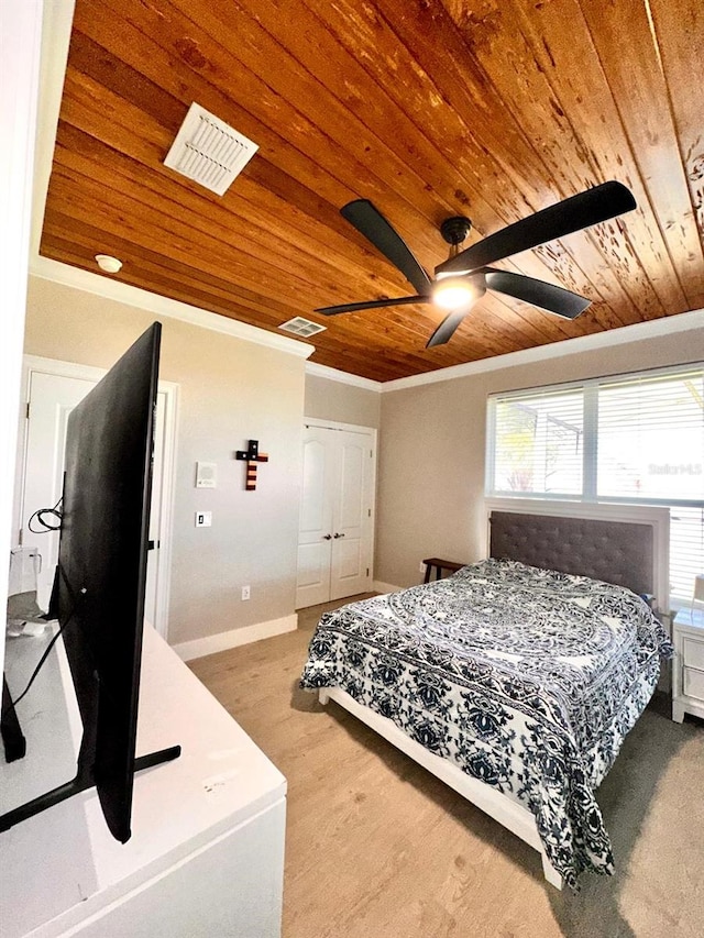 bedroom featuring visible vents, crown molding, baseboards, and wooden ceiling