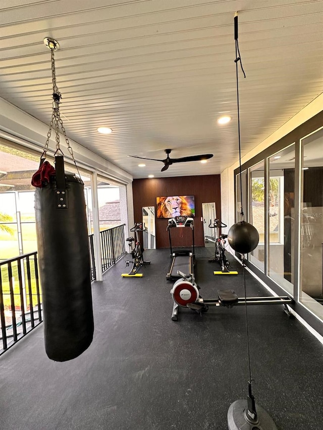 interior space with a ceiling fan, a wealth of natural light, and recessed lighting