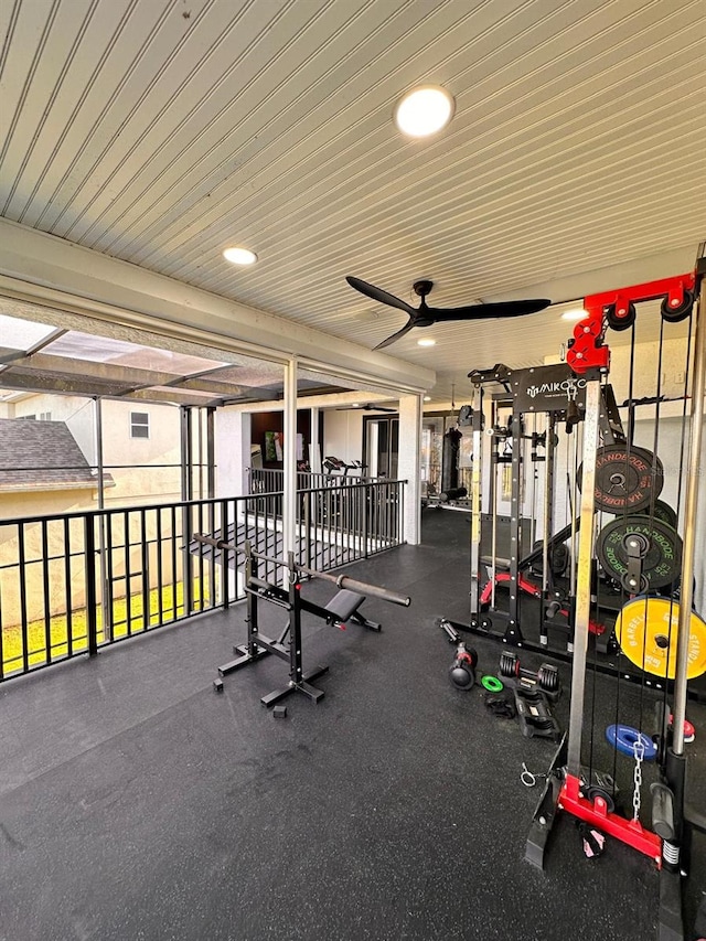 workout area featuring ceiling fan and wood ceiling