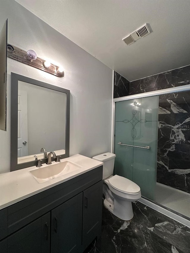 full bath featuring vanity, toilet, a stall shower, marble finish floor, and visible vents
