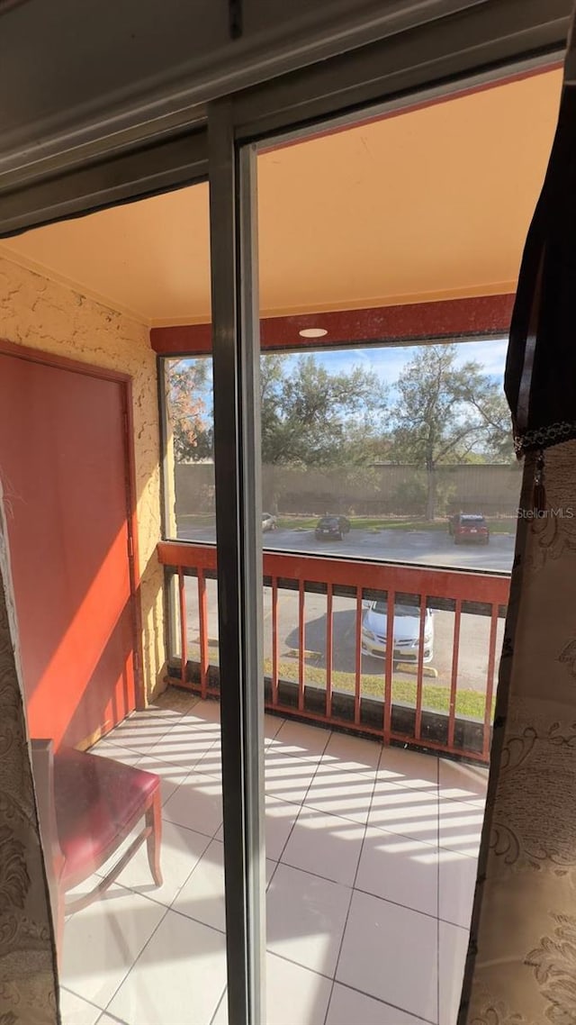 doorway to outside featuring tile patterned floors