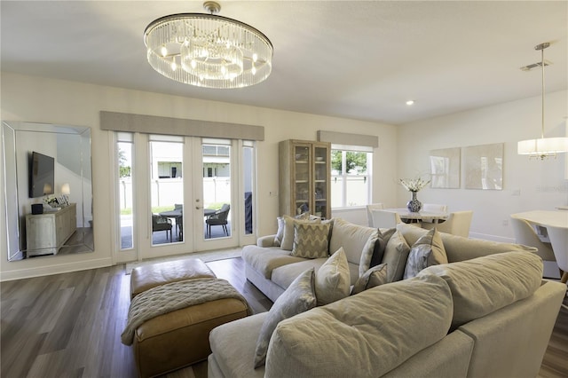 15079 Guava Bay Dr, Winter Garden, FL 34787 - living area with a chandelier, dark wood-style flooring, french doors, and recessed lighting