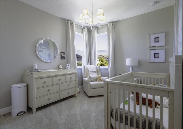 15079 Guava Bay Dr, Winter Garden, FL 34787 - bedroom with a chandelier, light colored carpet, and a crib