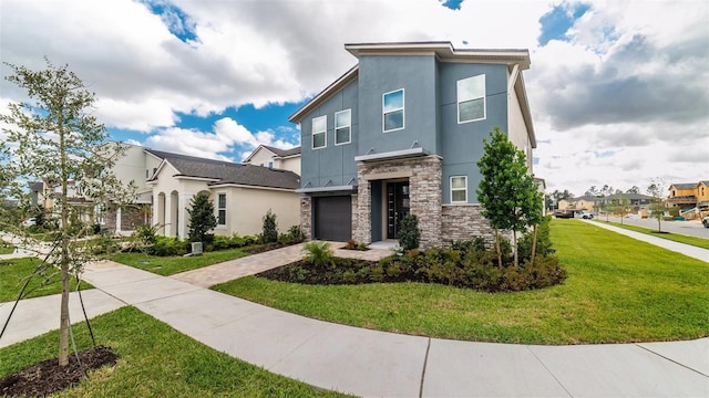 contemporary home featuring driveway, stucco siding, a front lawn, and stone siding