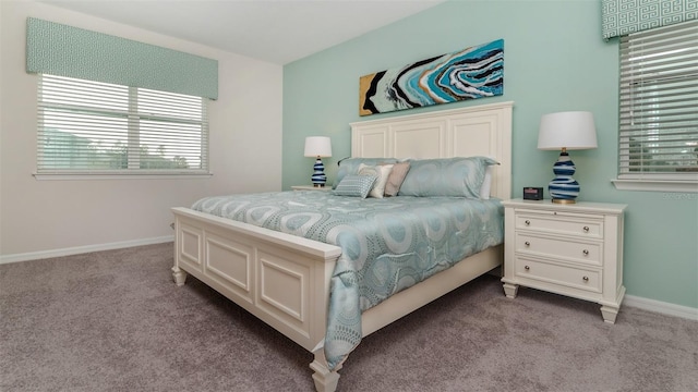 carpeted bedroom with baseboards