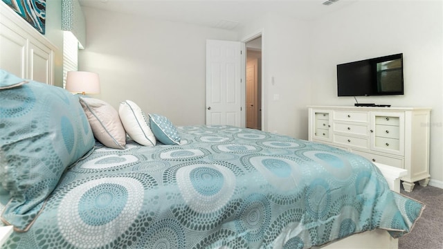 bedroom with visible vents and carpet floors
