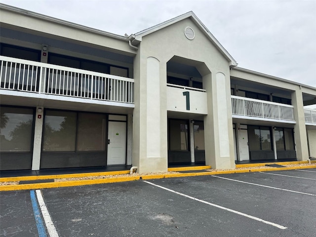 5245 W Irlo Bronson Memorial Hwy Unit 210, Kissimmee, FL 34746 - view of building exterior with uncovered parking