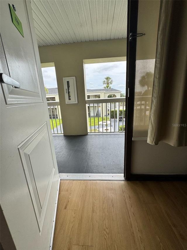 5245 W Irlo Bronson Memorial Hwy Unit 210, Kissimmee, FL 34746 - doorway to outside featuring a wealth of natural light and wood finished floors
