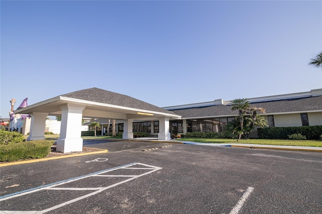 5245 W Irlo Bronson Memorial Hwy Unit 210, Kissimmee, FL 34746 - view of building exterior featuring uncovered parking