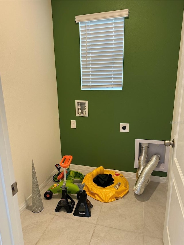 laundry room featuring electric dryer hookup, washer hookup, laundry area, and baseboards
