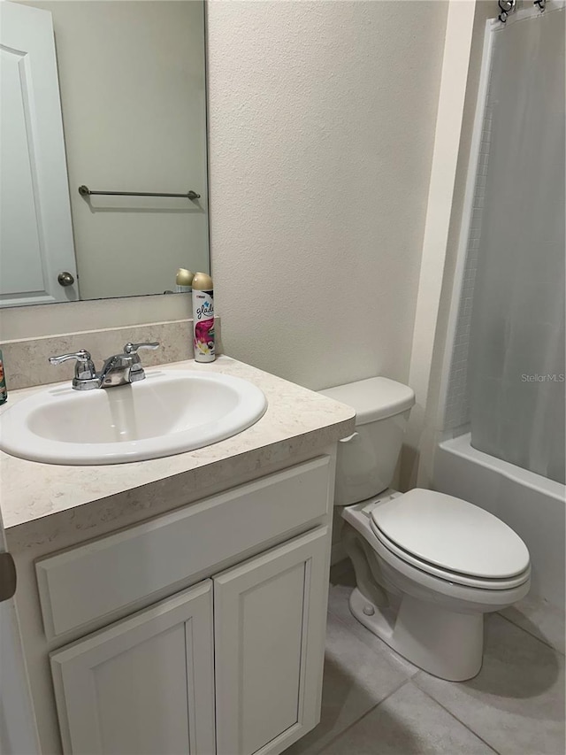 bathroom with tile patterned floors, shower / tub combo with curtain, toilet, and vanity