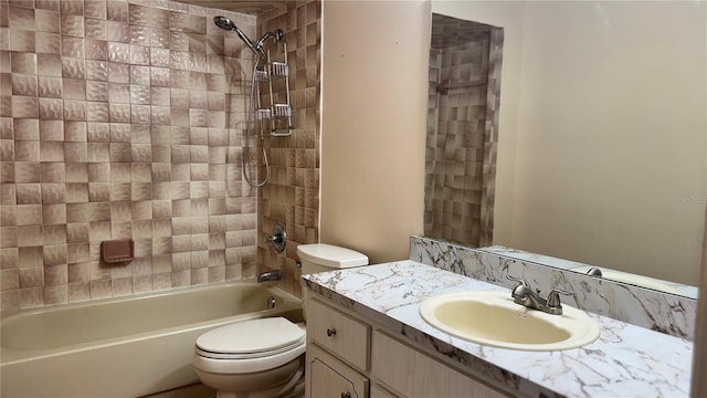 bathroom featuring vanity, toilet, and shower / bathtub combination