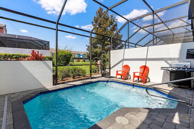 313 Captiva Dr, Davenport, FL 33896 - outdoor pool featuring a patio, a lanai, and a grill