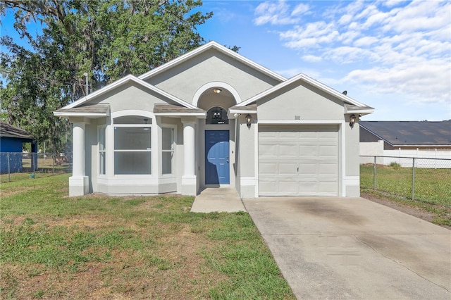 ranch-style house with a front lawn, a garage, concrete driveway, stucco siding, and fence