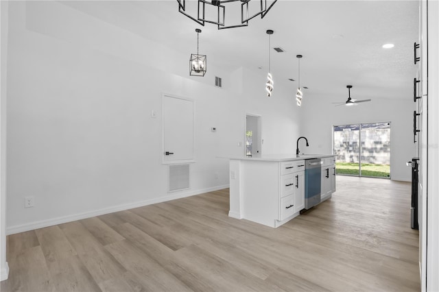 bar featuring visible vents, light wood-type flooring, dishwasher, decorative light fixtures, and ceiling fan with notable chandelier