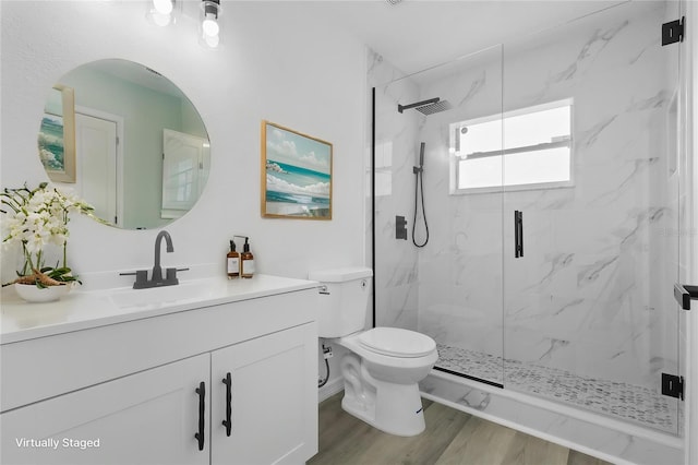 108 Pearlwood St, Orlando, FL 32811 - full bath with a marble finish shower, toilet, vanity, and wood finished floors