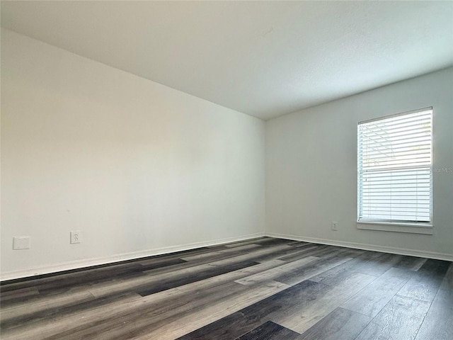 1799 N Highland Ave Unit 143, Clearwater, FL 33755 - spare room featuring dark wood-style floors and baseboards