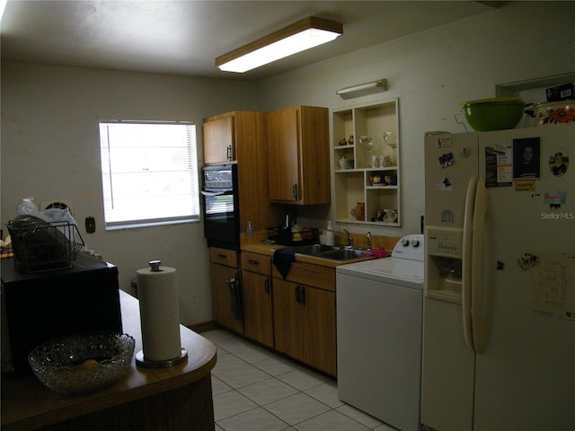 kitchen featuring light tile patterned floors, white fridge with ice dispenser, open shelves, black oven, and washer / dryer